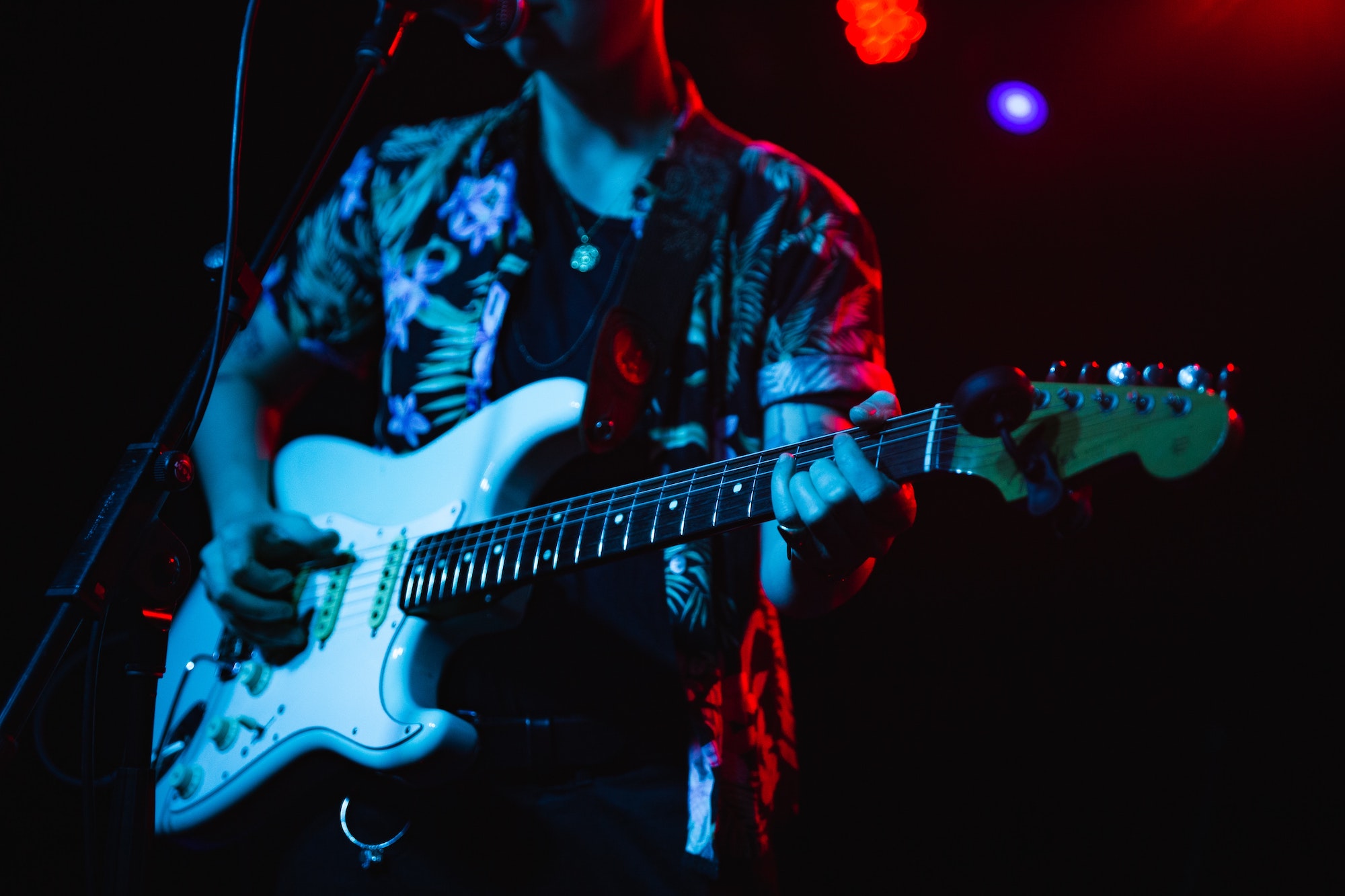 A guitarist playing the guitar